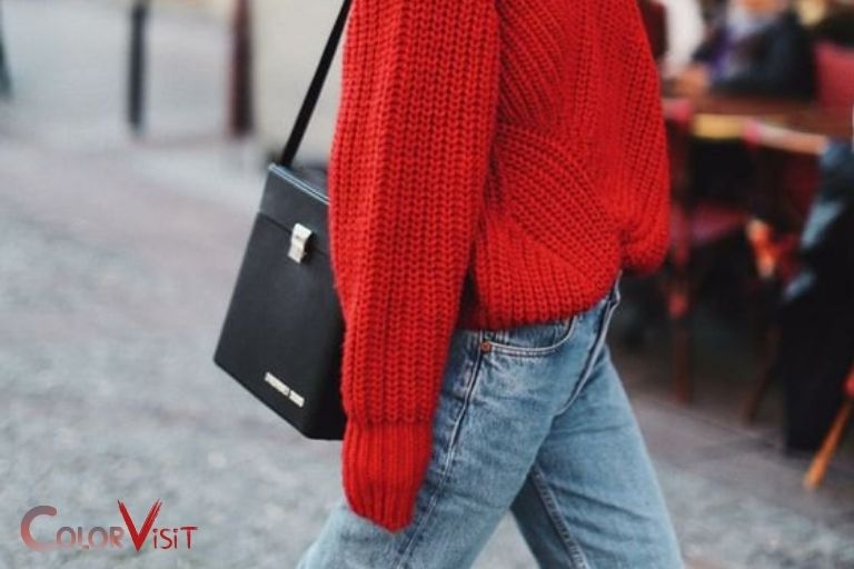 Woman in red sweater and gray pants sitting on gray concrete bench photo   Free Black Image on Unsplash